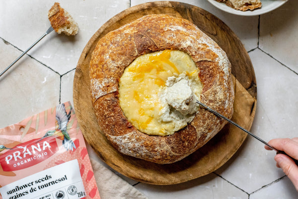 Warm sunflower seed dip in a bread bowl